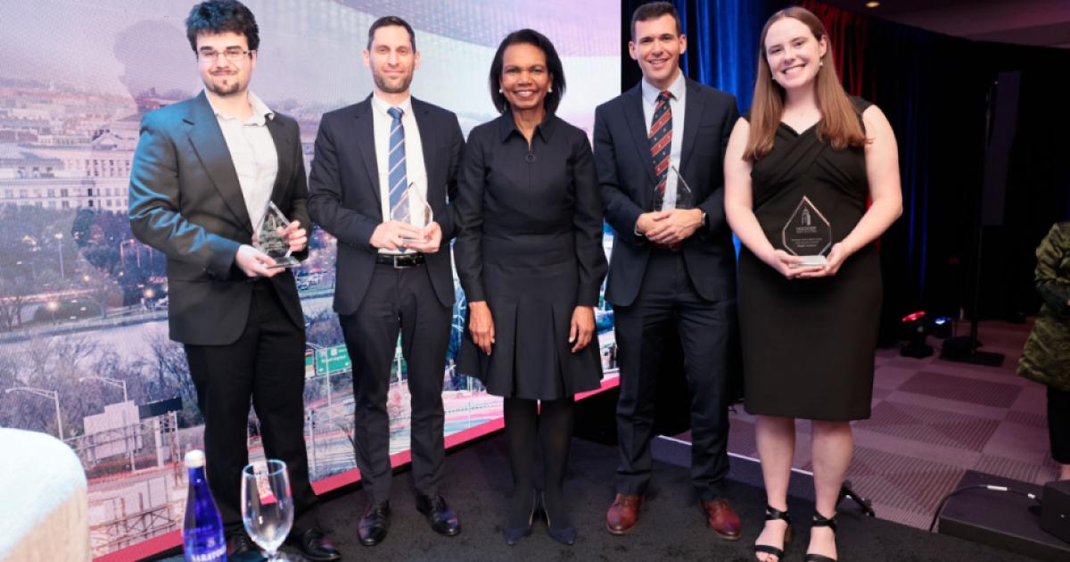 Winners of the 2025 HISPBC Student Essay Competition stand with Hoover Institution Director Condoleezza Rice on February 22, 2026. (Eric Draper)