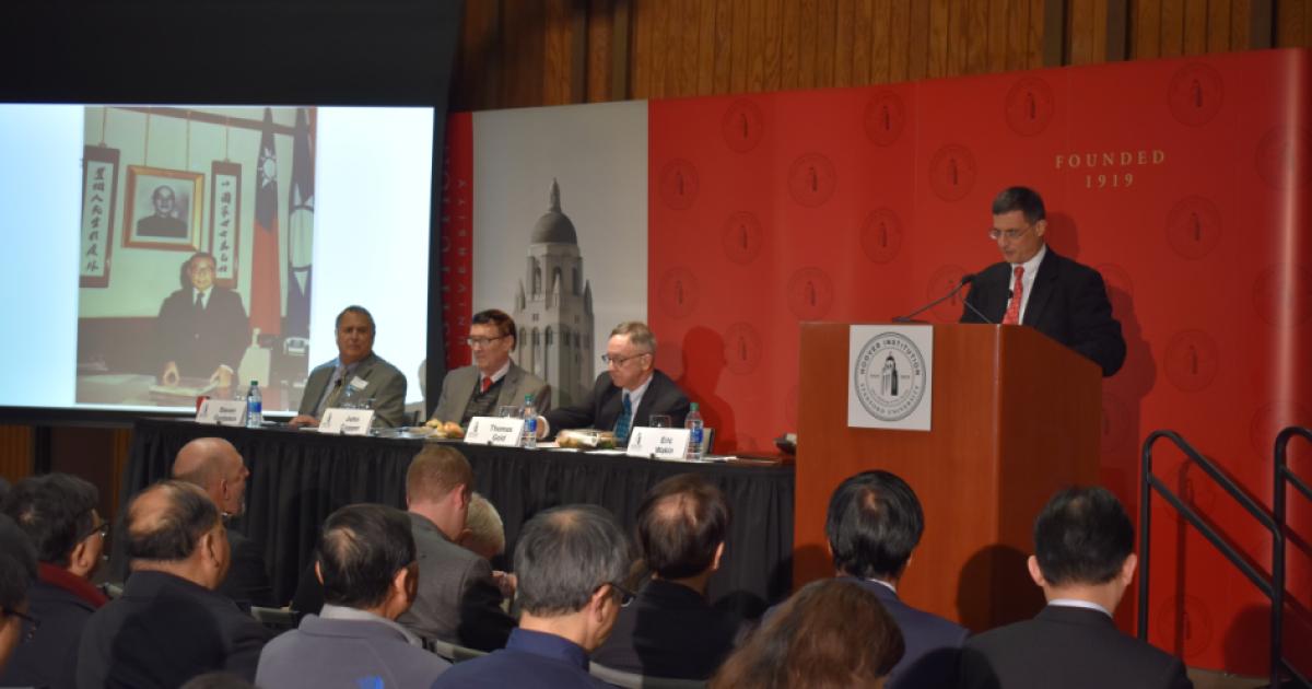 Hoover deputy director Eric Wakin (right) moderated the discussion.