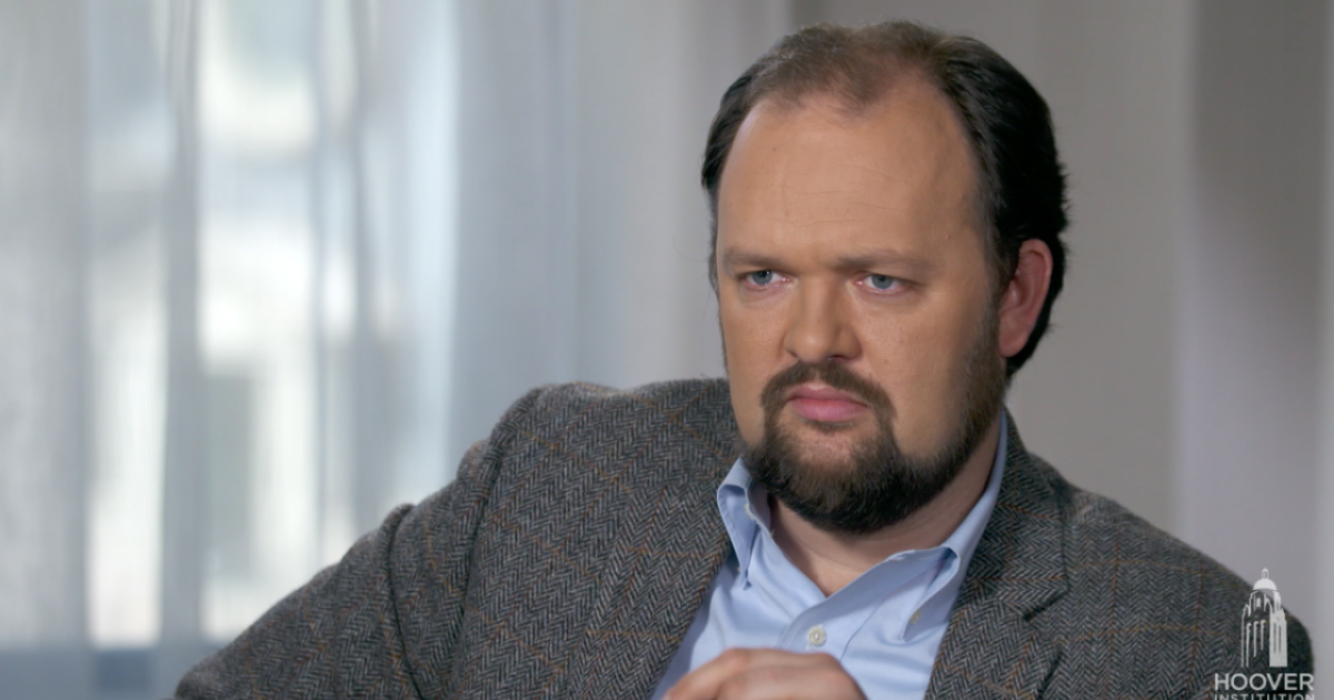 Image of Ross Douthat with a grey background