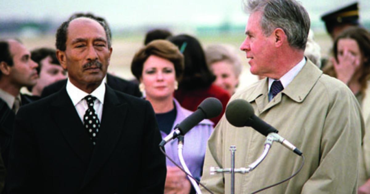 Egyptian President Anwar Sadat, left, arrives at Andrews Air Force Base in 1980