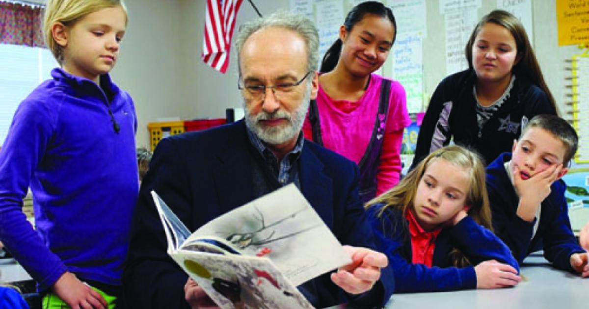 Huffman reading to schoolchildren