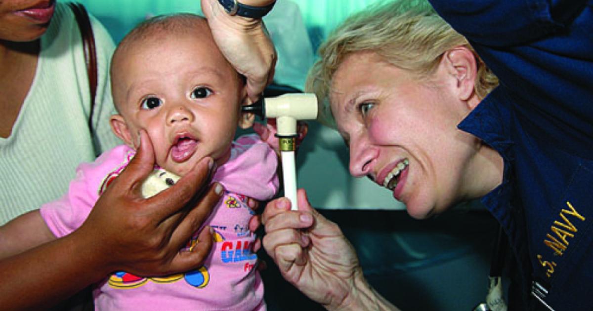 Ronda Bouwens examines a baby