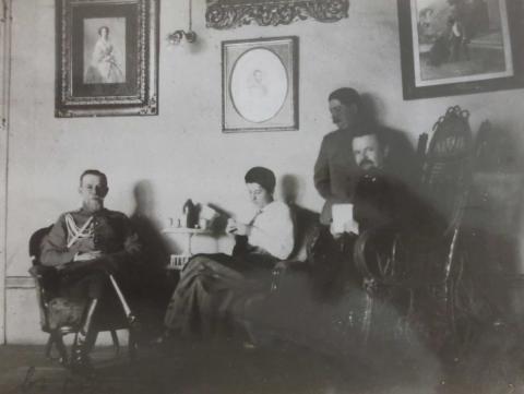 Trubetskoi with group in a sitting room