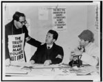 Three St. John's University teachers conferring at strike headquarters