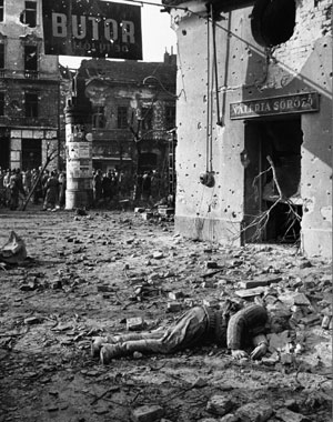 Hungarians with dead Soviet soldier in 1956 uprising