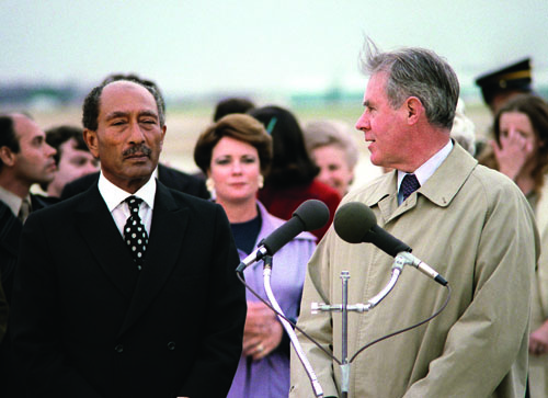 Egyptian President Anwar Sadat, left, arrives at Andrews Air Force Base in 1980