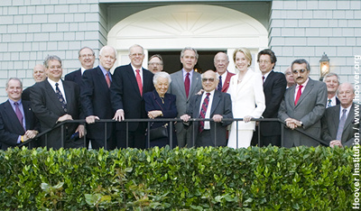 Hoover fellows and overseers, along with Stanford University officials, gather with President Bush (center) at the conclusion of the meeting.